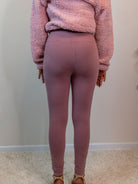 Snug-fitting leggings available in Black, Charcoal, and Dusty Rose, made from 95% cotton and 5% spandex for comfort and stretch. Model is 5'4" wearing a small. Dusty rose back