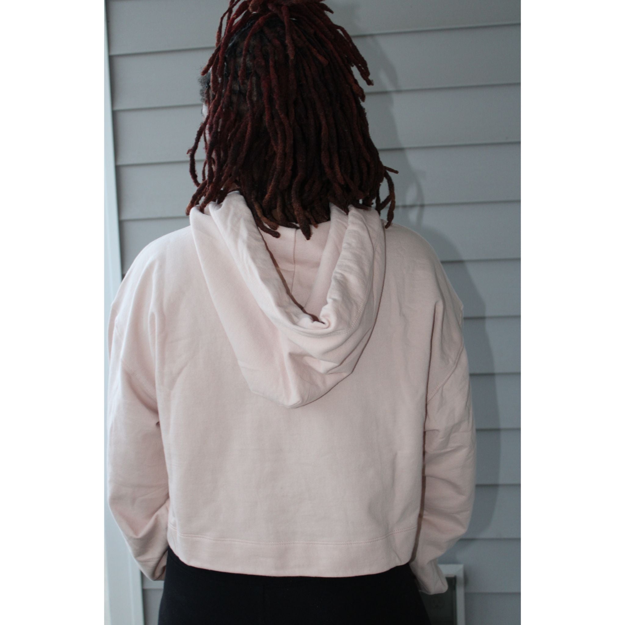 Model showing the back of the crop top hoodie